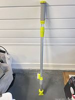 Full view of motorized pool vacuum brush with telescopic handle