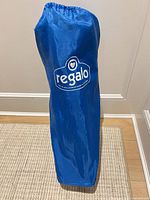 Blue Regalo carry bag standing upright
