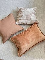 Three pillows arranged on sofa