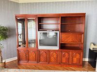 Full view of three-piece entertainment center showing layout and finish