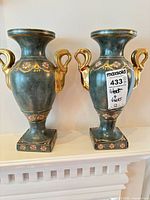 Front view of both matching Toyo vases showing overall form, color and handles