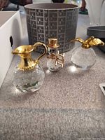 All three crystal figurines grouped together on surface