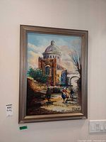 Full view of framed Ferizi cityscape painting on wall