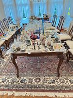 Full view of mauve floral wool area rug under dining table