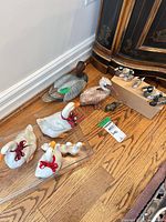 Group of ceramic geese, goslings, two wooden duck decoys, shorebird decoy set, small frog