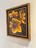 Framed oil painting of yellow flowers