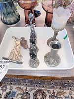 Overall view of tray with three candlesticks and angel figurine