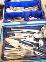 Open box showing place settings and some serving pieces