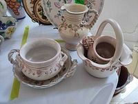 Group shot showing all four earthenware pieces