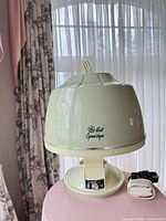 Full view of GE hood hair dryer showing color and overall design