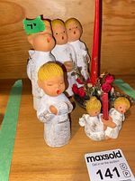 Group view of all five angel pieces with candle holder