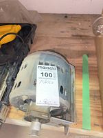 Overall view of blower motor showing housing and Maxsold tag