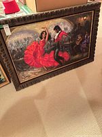 Full view of framed painting on floor