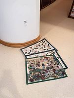 Three tapestry panels laid on carpet