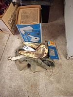 Anchor, boxed Anchor Mate, hardware pack and bag on garage floor