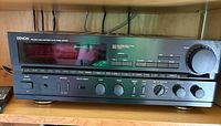 Front view of Denon DRA-825R receiver, controls and display visible