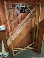 Full view of garment rack with hangers attached