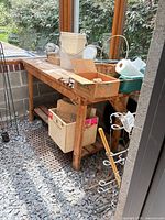 Full view of wood potting bench with top and lower shelf