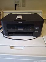 Full view of Epson XP-4200 printer on appliance showing overall condition and power cord