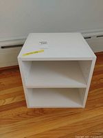 Front view showing open front and adjustable shelf