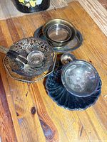 Group of all items: basket with utensils, small bowls, tray, shell dish