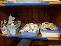 overall view of bins filled with assorted travel soaps and toiletries on shelf