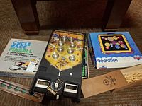Overview of pinball unit, Cycle Race box lid, Gearation box, wooden slide-top box
