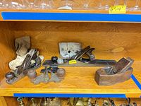 Shelf view showing all four planes and canvas bags