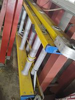 Yellow extension ladder with boxed Corner Buddy