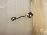 Full view of miniature spoon on surface