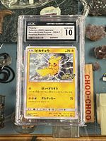 Front view of CGC-encased Pikachu promo card with grading label