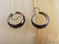 Front view of both sterling hoop earrings