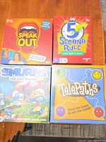 Front view of all four game boxes: Speak Out, 5 Second Rule, Smurfs: The Lost Village, Telepaths