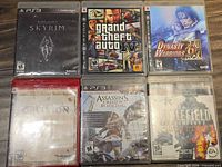 Front view of six PS3 games in cases