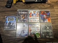 Seven PS3 game cases laid out front showing cover art