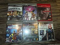 Front view of six PS3 game cases