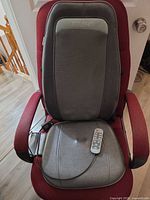 Full view of Renpho massage cushion on chair showing backrest, seat, remote and cord