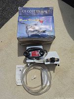 Box, pump assembly with hoses and manual laid out