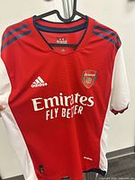 Front view showing club crest, Adidas logo and sponsor