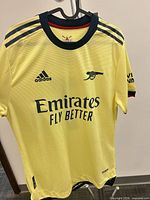 Front view showing color, sponsor, logos, sleeve style