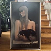 Full view of framed poster on stair landing