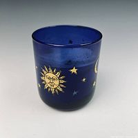 Front view showing cobalt blue glass and gold sun, stars decoration