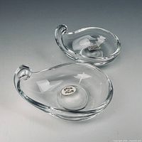 Two clear teardrop Murano bowls side by side