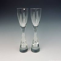 Front view of the pair of Holmegaard Princess schnapps glasses standing upright