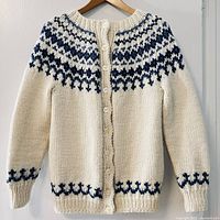 Front view of cream cardigan with navy Fair Isle pattern