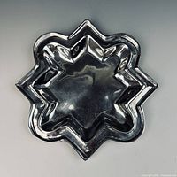 Top view of star-shaped cast aluminum dish
