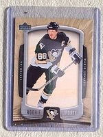 Front view of sleeved 2005-06 Upper Deck Mario Lemieux card