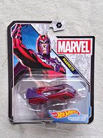 Front of sealed Magneto Character Car on card