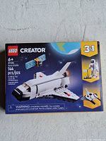 Front of sealed LEGO Creator 31134 box showing shuttle model, piece count and age range