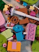 Pile of assorted LEGO-compatible parts showing variety and condition
